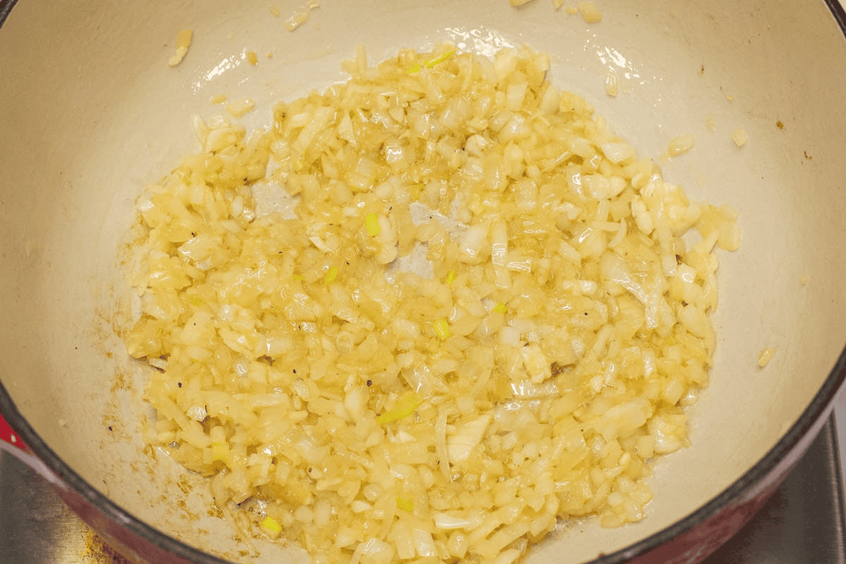 Sauteing the aromatics in the pot.