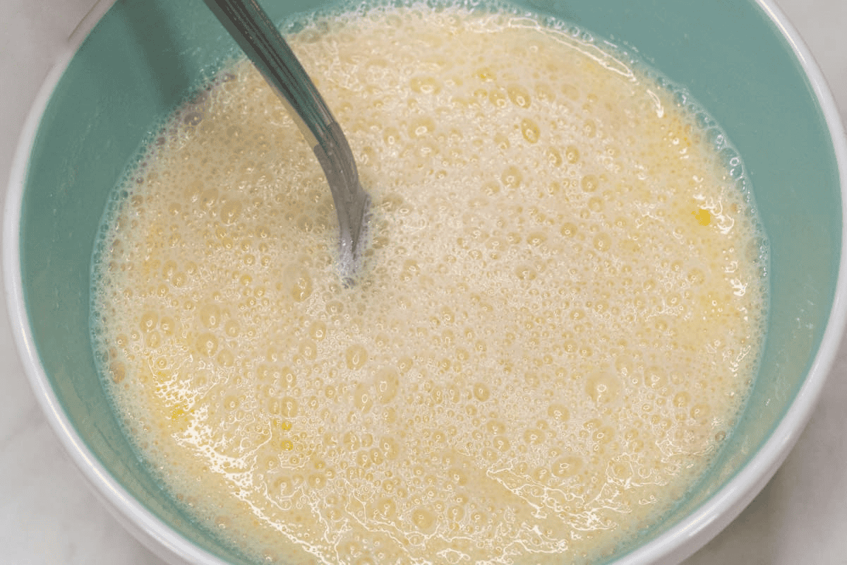 Mixing the wet ingredients in the bowl.