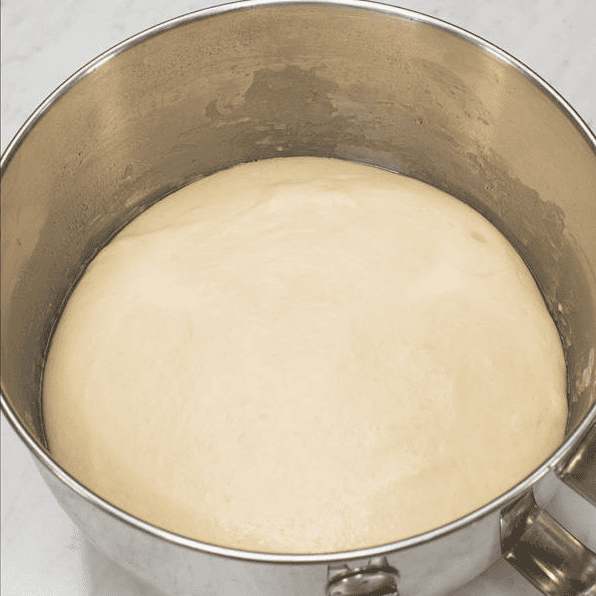Spanish bread dough doubled in size after its first rise.
