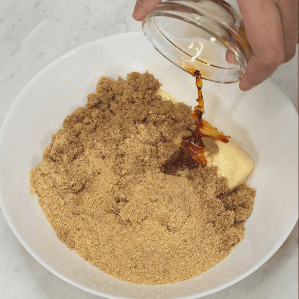 Adding vanilla to the breadcrumbs, butter, and brown sugar for the filling.