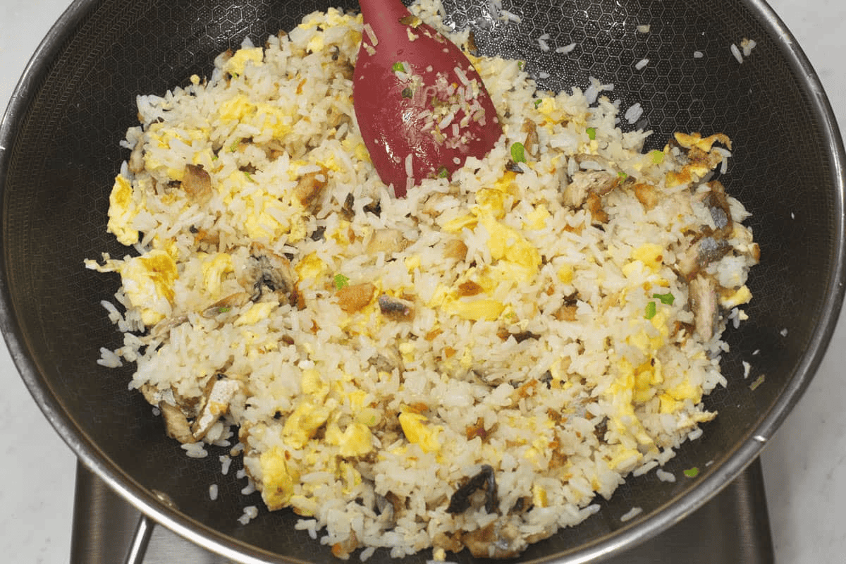 Tossing Tinapa Fried Rice in a wok.