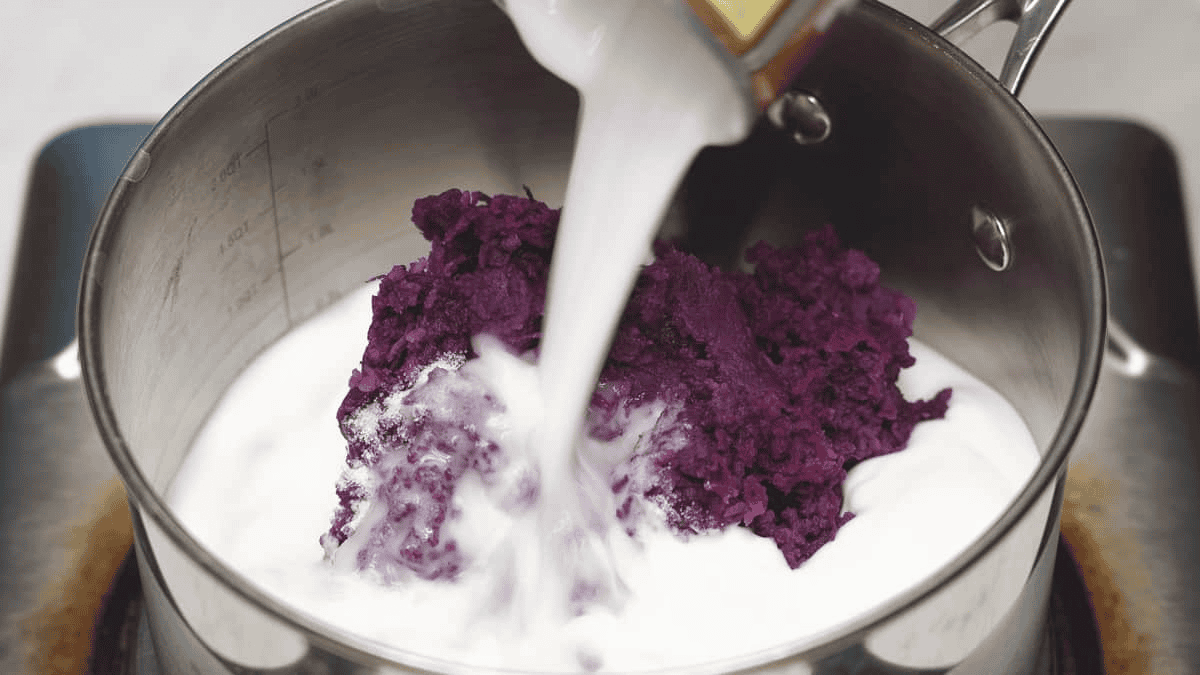 Ube Halaya (Purple Yam Jam) ingredients in a saucepan.