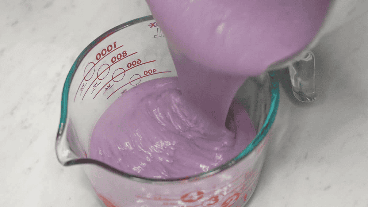 Pouring the ice cream base in a container.