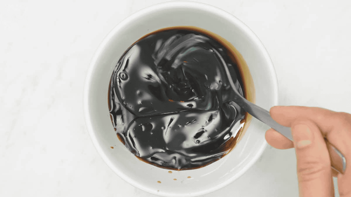 Mixing the sauce in the bowl.
