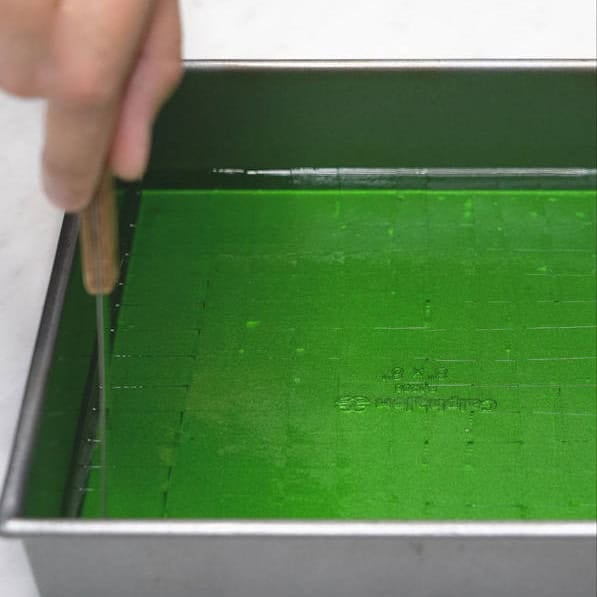 Cutting agar-agar into small squares. Adding agar-agar cubes to the mixture.