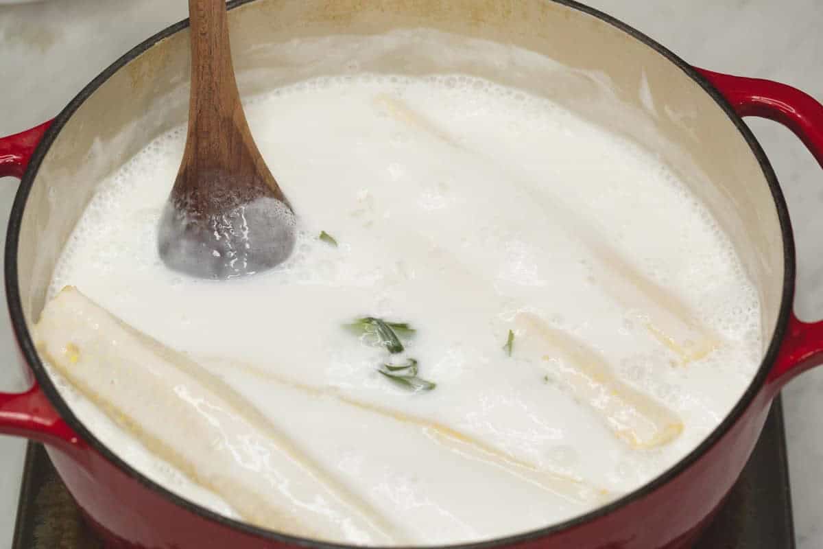 Stirring the mixture while boiling.