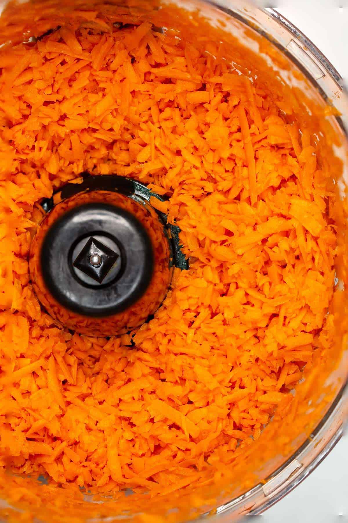 Finely grated carrots in the food processor.