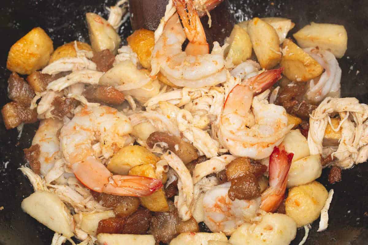 Cooking the proteins in the wok.