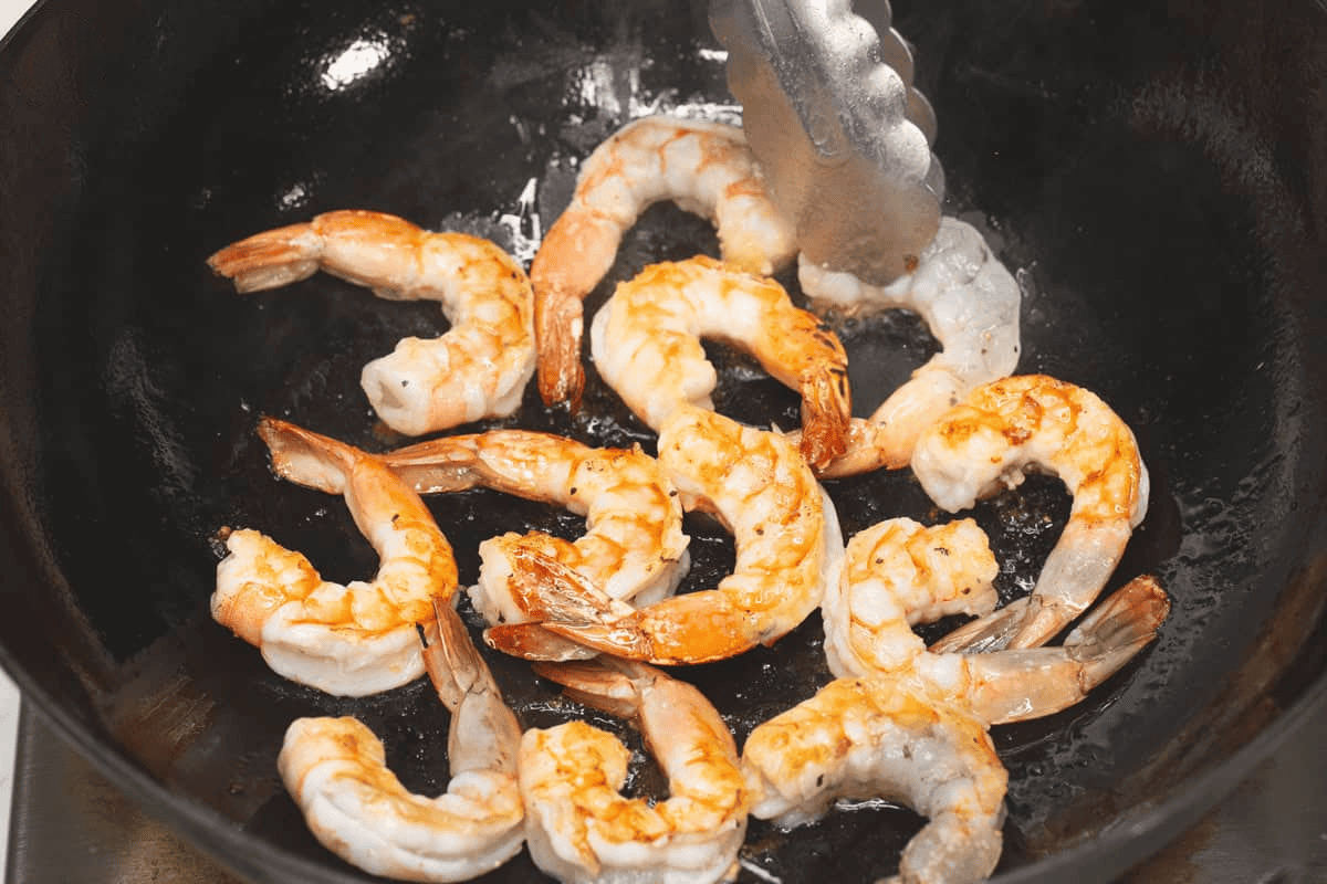 Searing the shrimp in the wok.