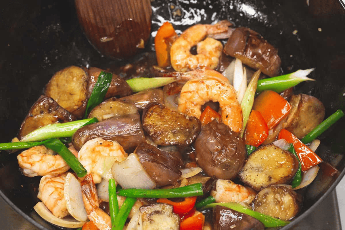 Cooked Eggplant Stir Fry with Shrimp in the wok.