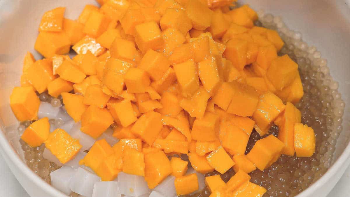 Sago, nata de coco, and mangoes in a large bowl.