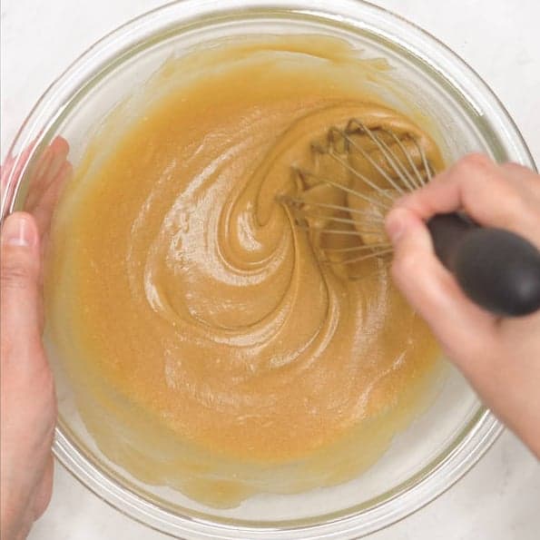 Combining the ingredients in a bowl. Whisking the ingredients in a bowl.