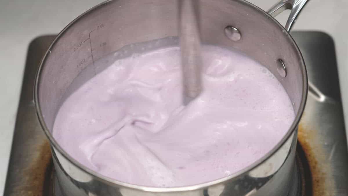 Mixing the ingredients in the saucepan with an immersion blender.