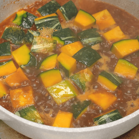 Simmering kabocha squash in the broth.