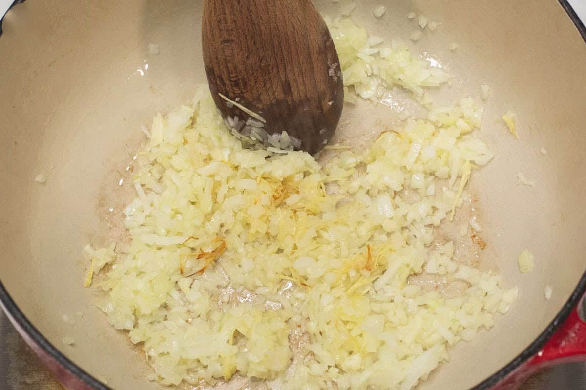 Sauteing the onions and garlic in the pot.