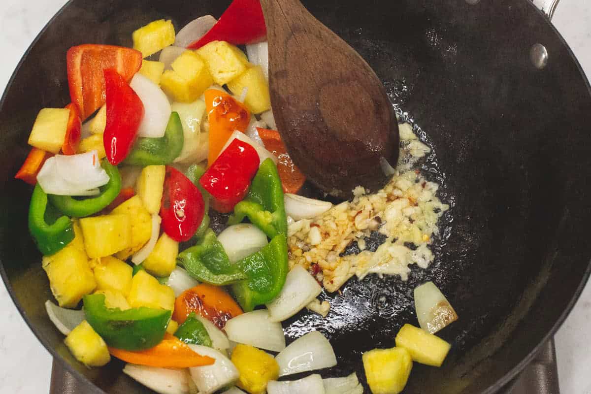 Sauteing the aromatics in the wok.