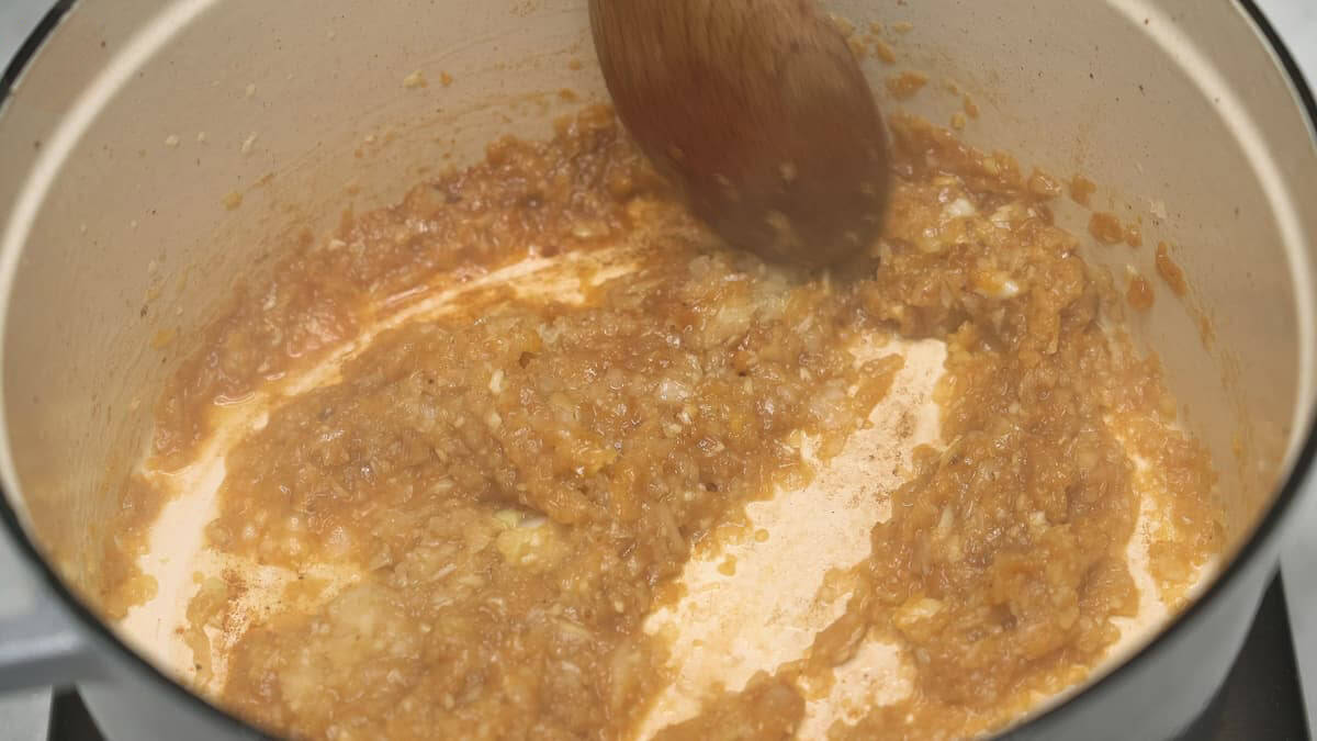 Sauteing onions and garlic in a Dutch oven.