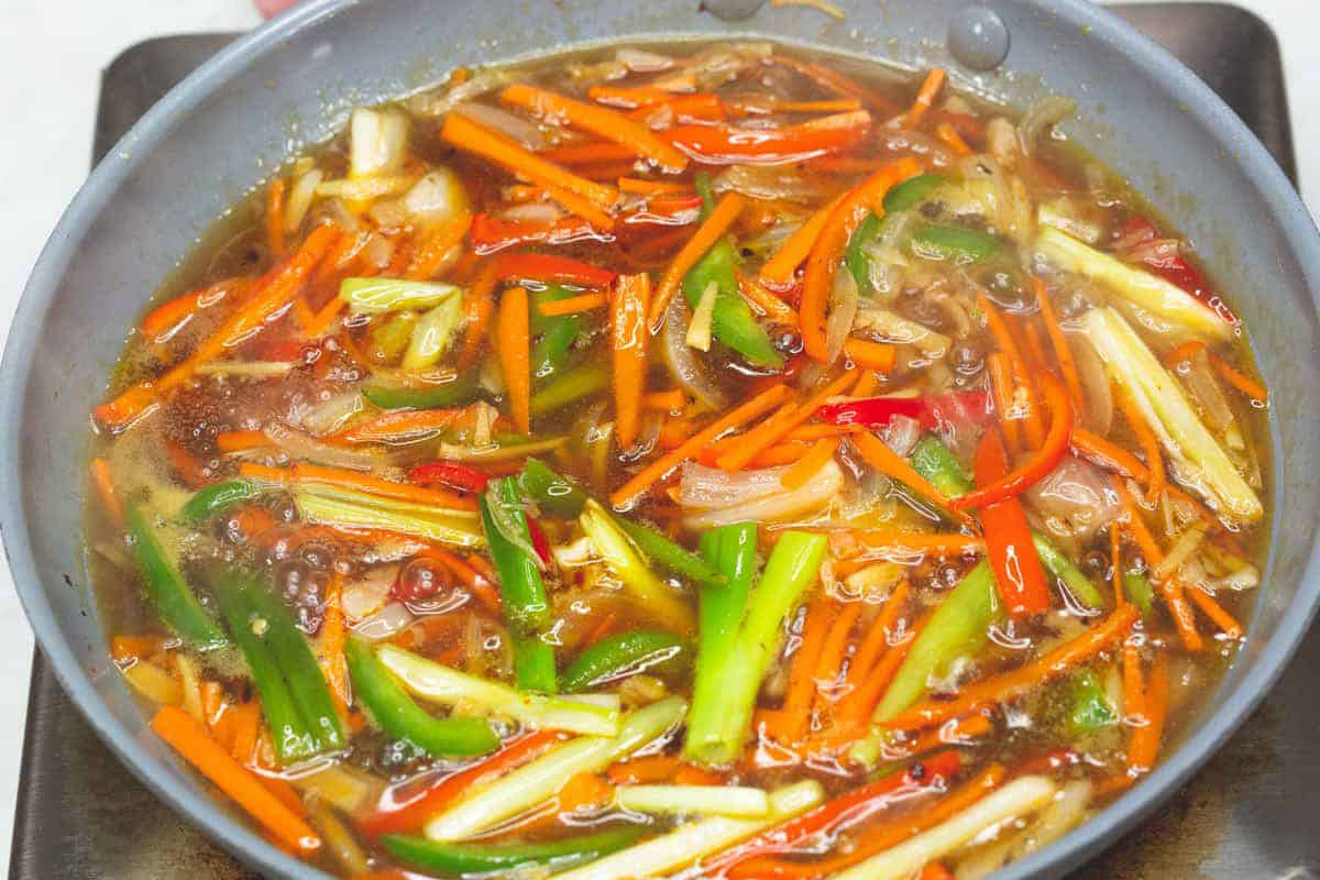 Simmering the sauce in the skillet.