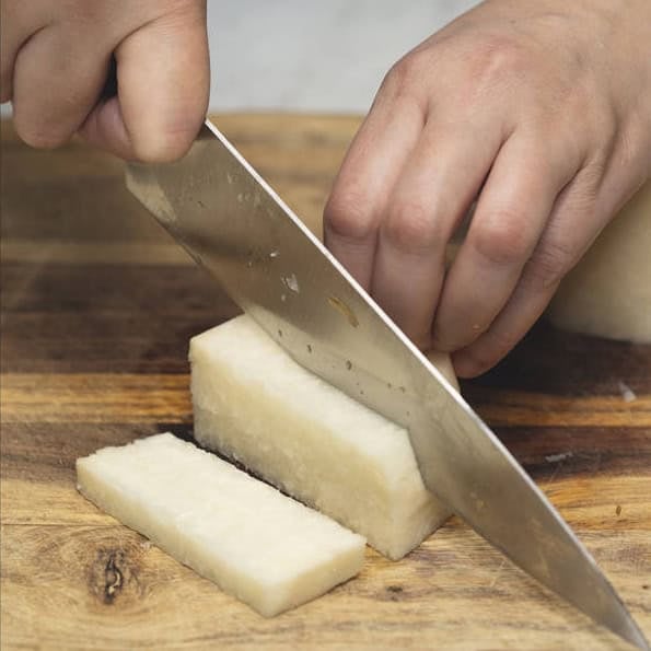Slicing the jicama and cutting them into sticks.