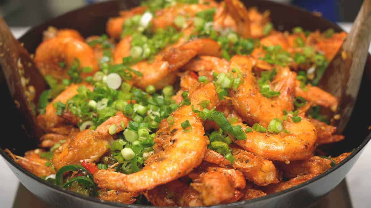 Added the shrimp and scallions to the wok.