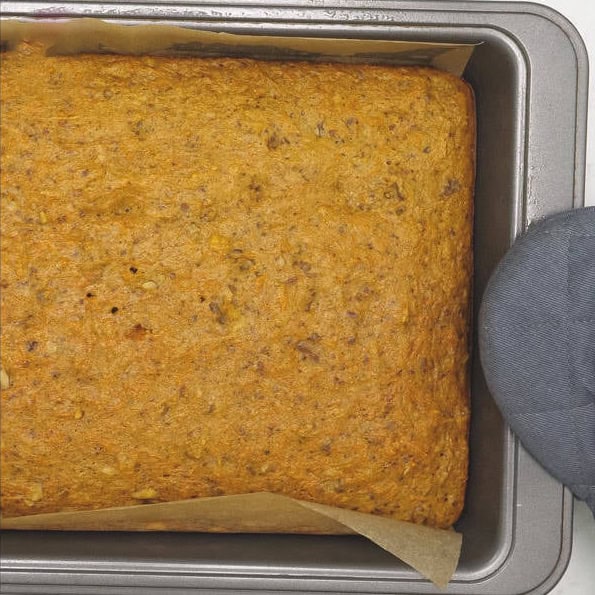 Spreading the cake batter onto the pan. Baked carrot sheet cake in the pan.