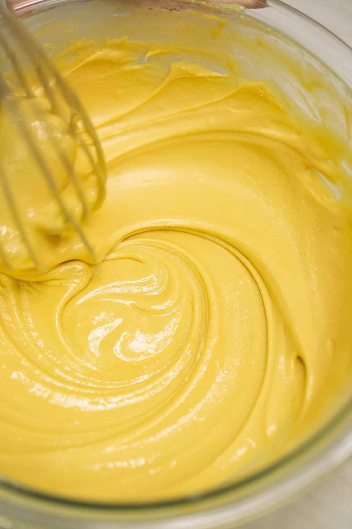 Whisking the zabaglione in the bowl.
